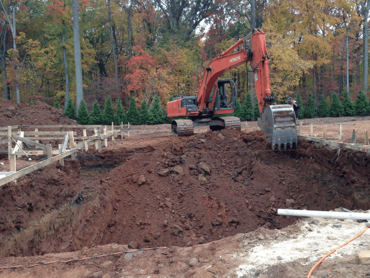 Excavation by a pool construction crew