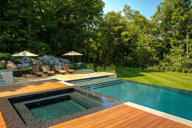 Minimalist pool with wooden deck concept image for luxury swimming pool design