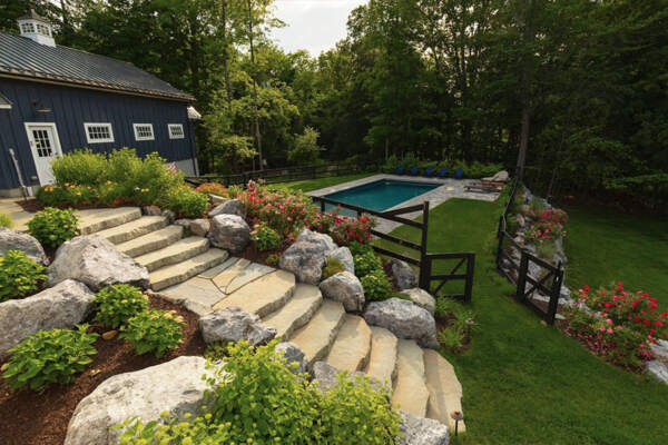 A beautiful pool surrounded by nature and an elegant landscape