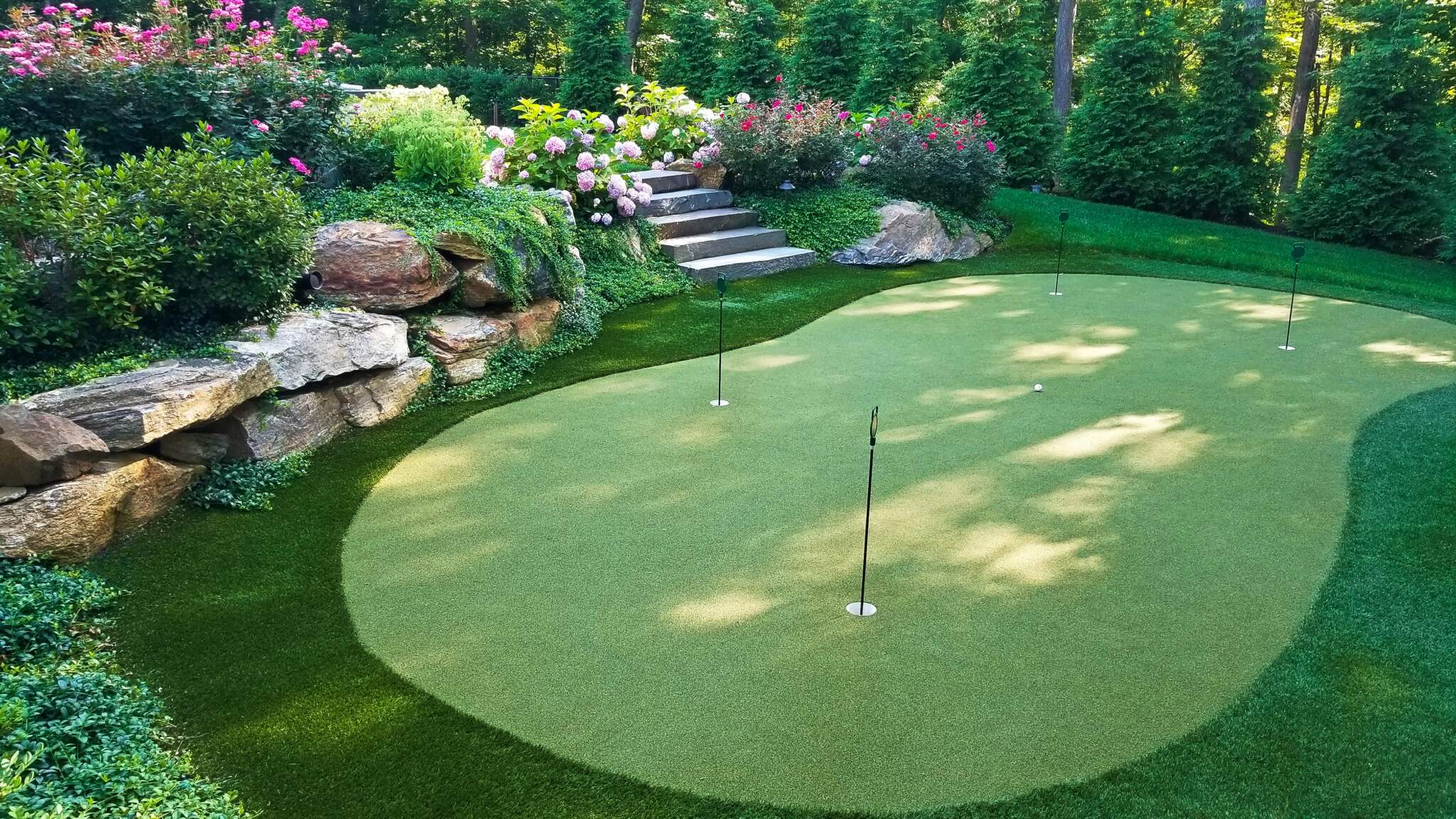 20170721_082235 Backyard courts installed by Neave include this stunning construction of a putting green to practice your golf game