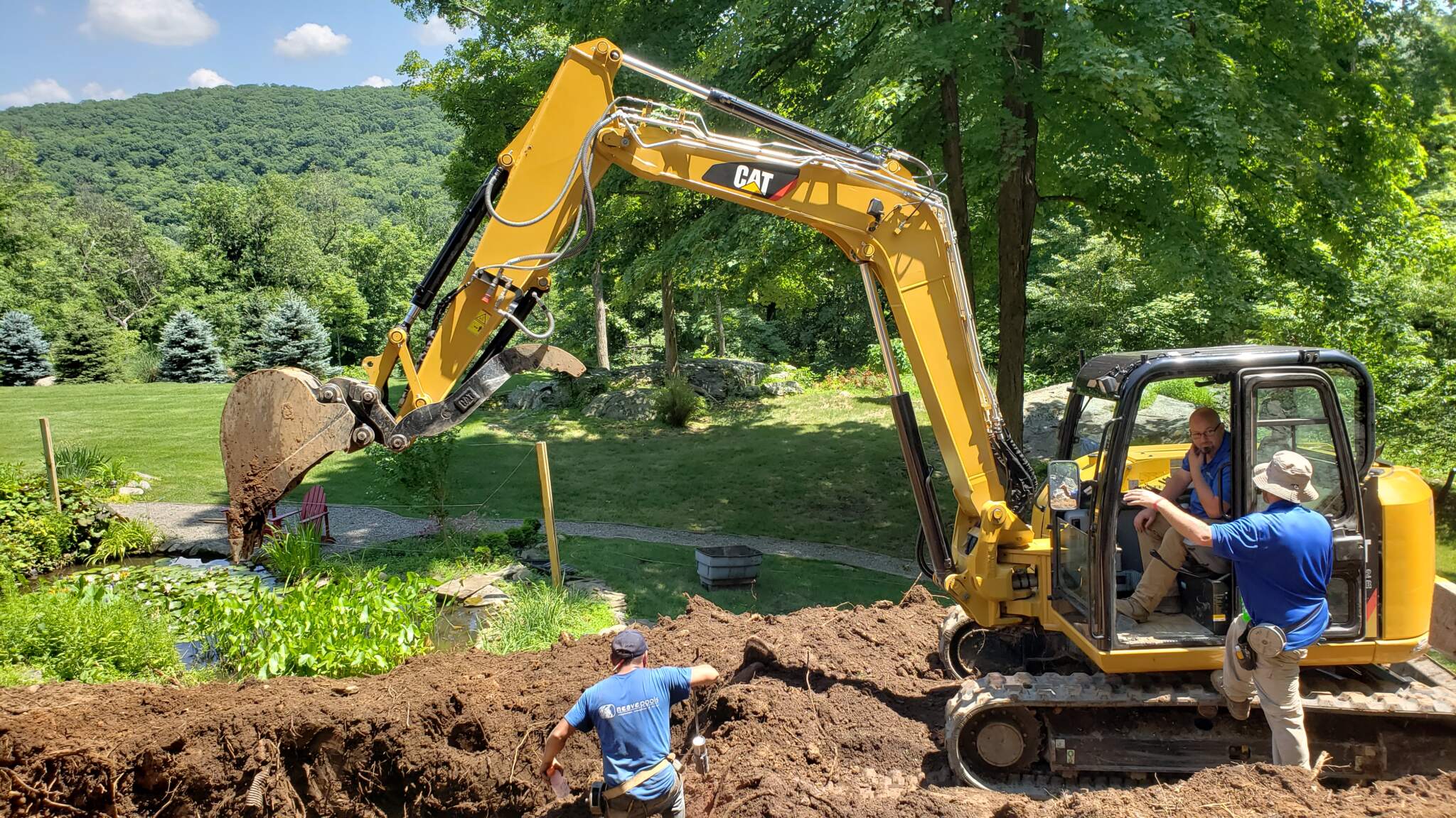 7992687e-a03a-4ea5-ba20-ef625755bd9e A pool company being careful to avoid plumbing lines when excavating for a swimming pool