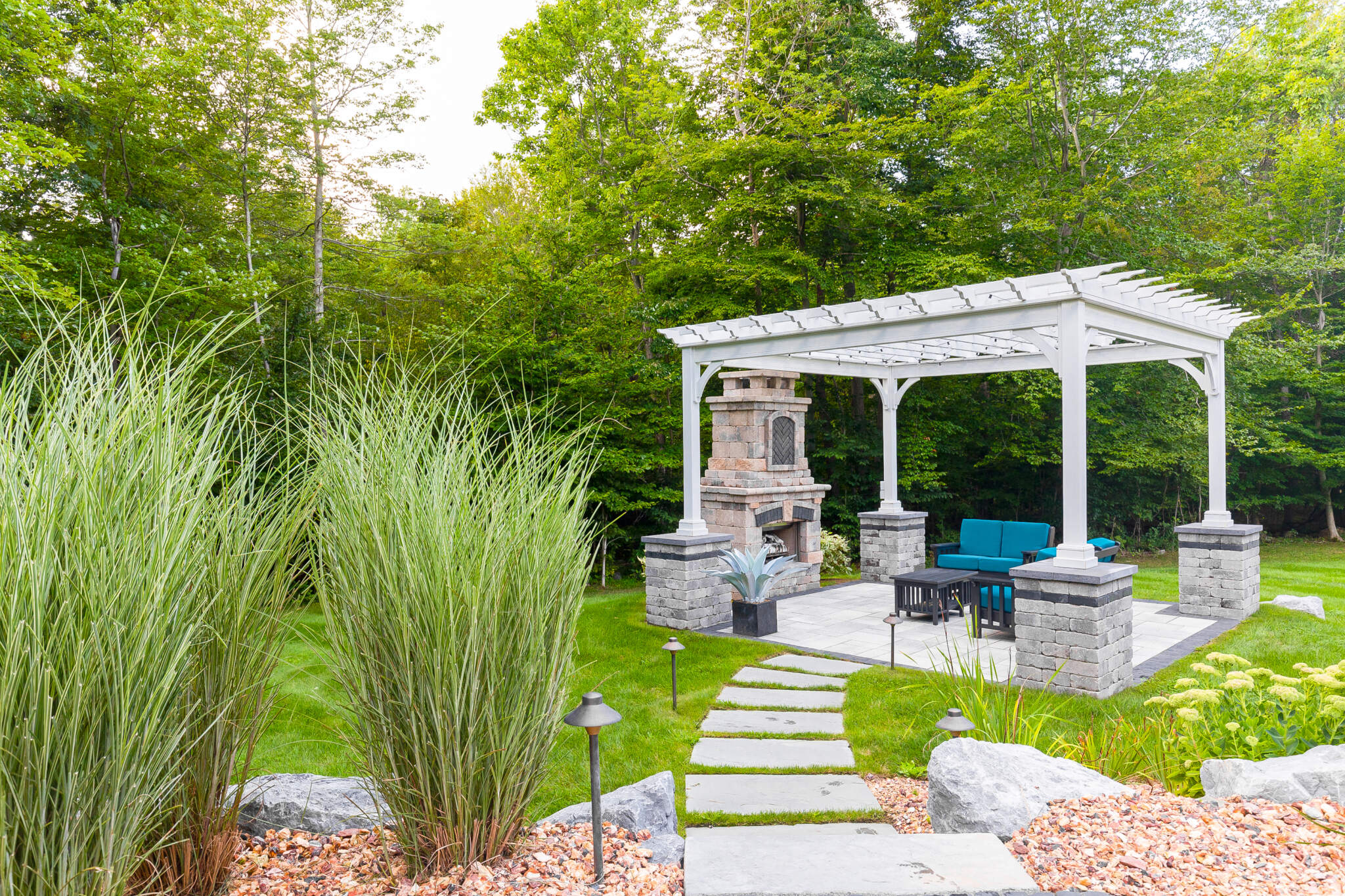 d60f1c25-804e-49ca-a521-83da9c1671c9 Image of beautiful landscaping in Putnam County, where homeowners can easily walk on stones to their gazebo