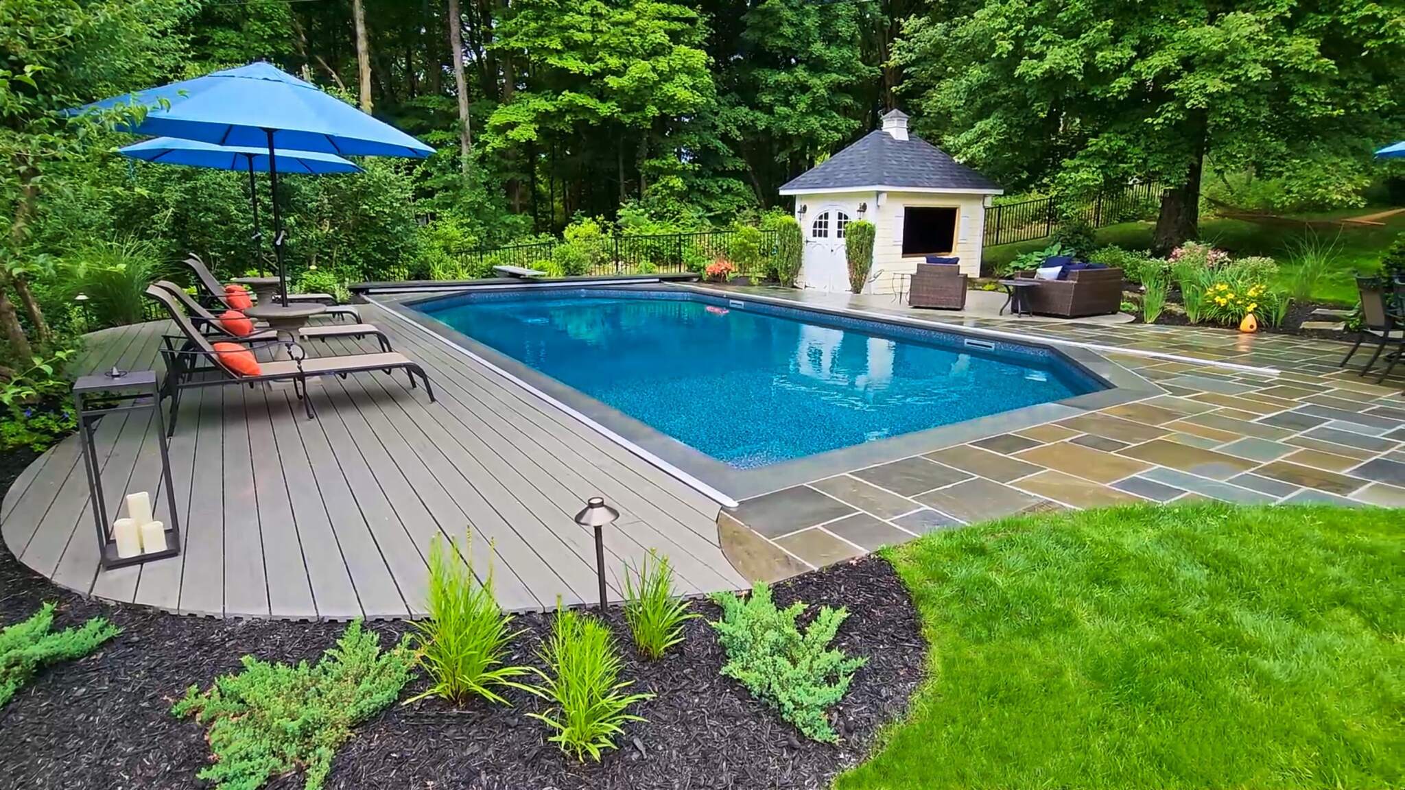 Pool Renovation- After Image of beautiful landscaping in Putnam County, where homeowners can easily walk on stones to their gazebo