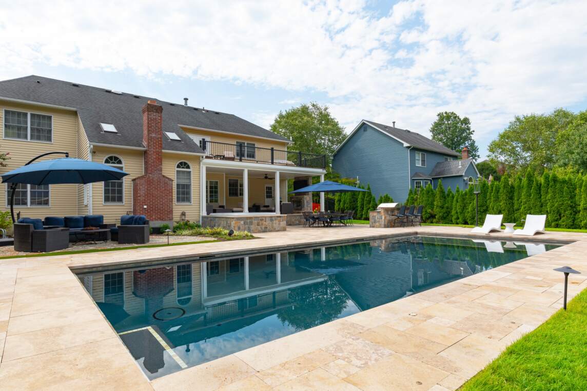 Newly renovated rectangle pool showcasing Neave Group diverse capabilities for pool renovation services