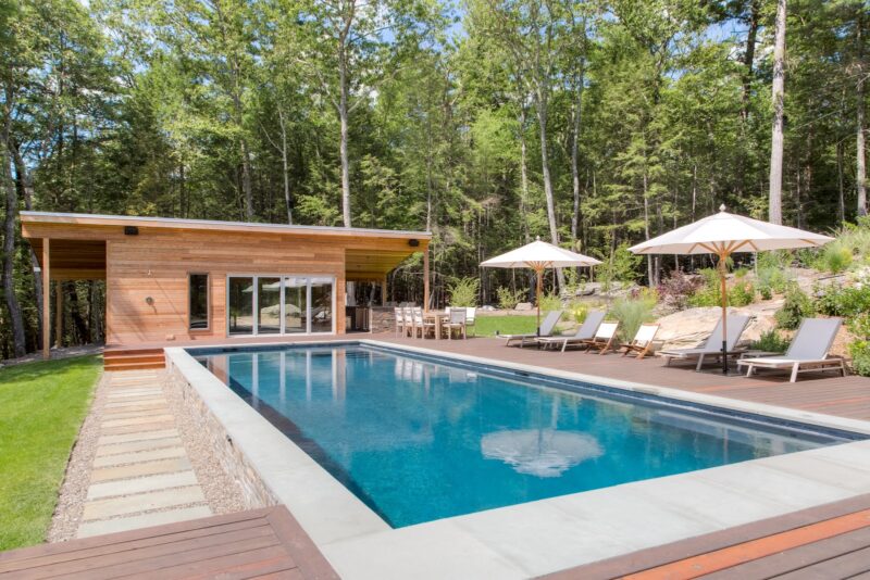 A modern rectangular pool illustrating a gunite or fiberglass pool build