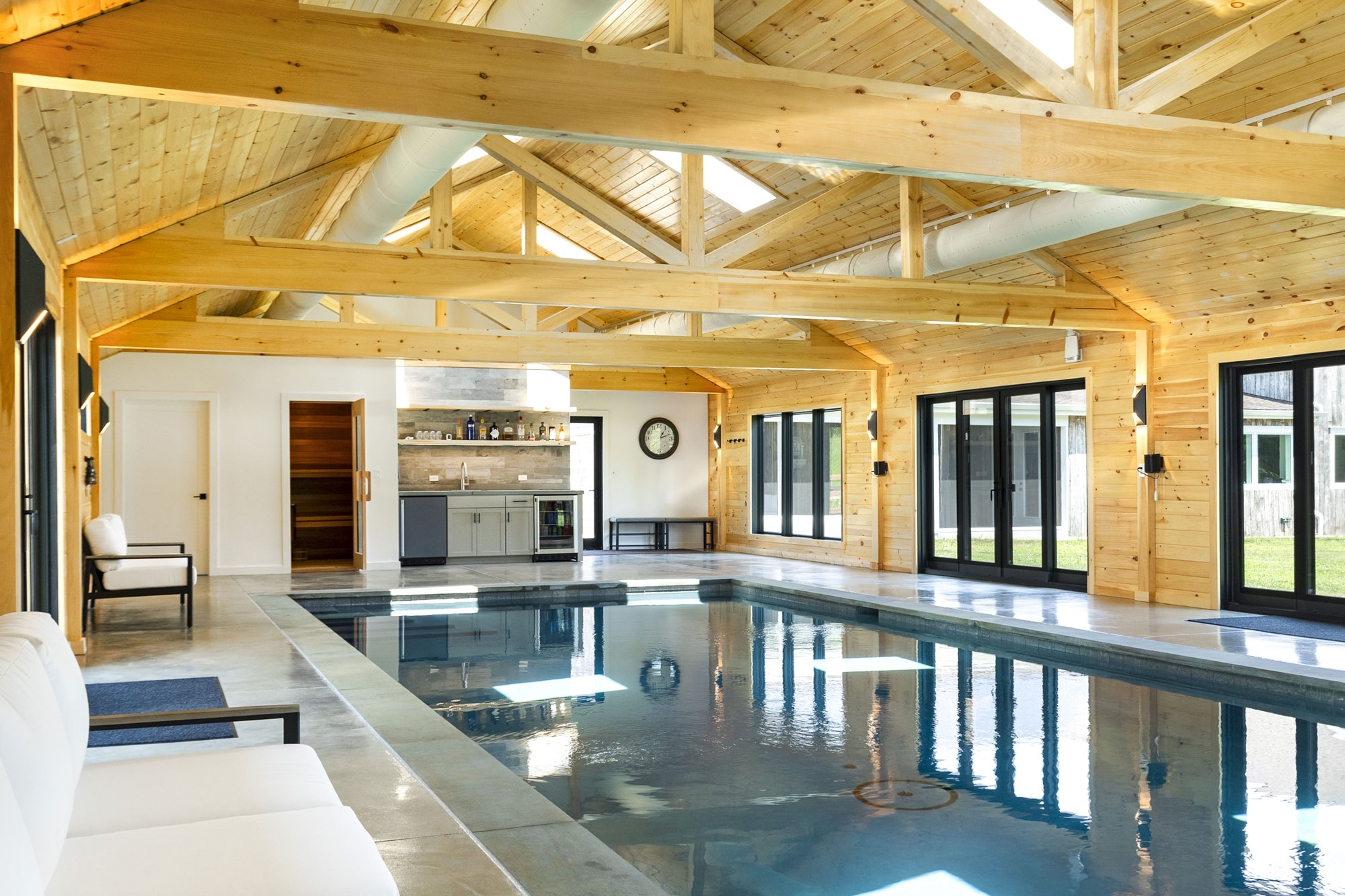Indoor pool project featuring personalized kitchen near Greenwich Connecticut by Neave Outdoor