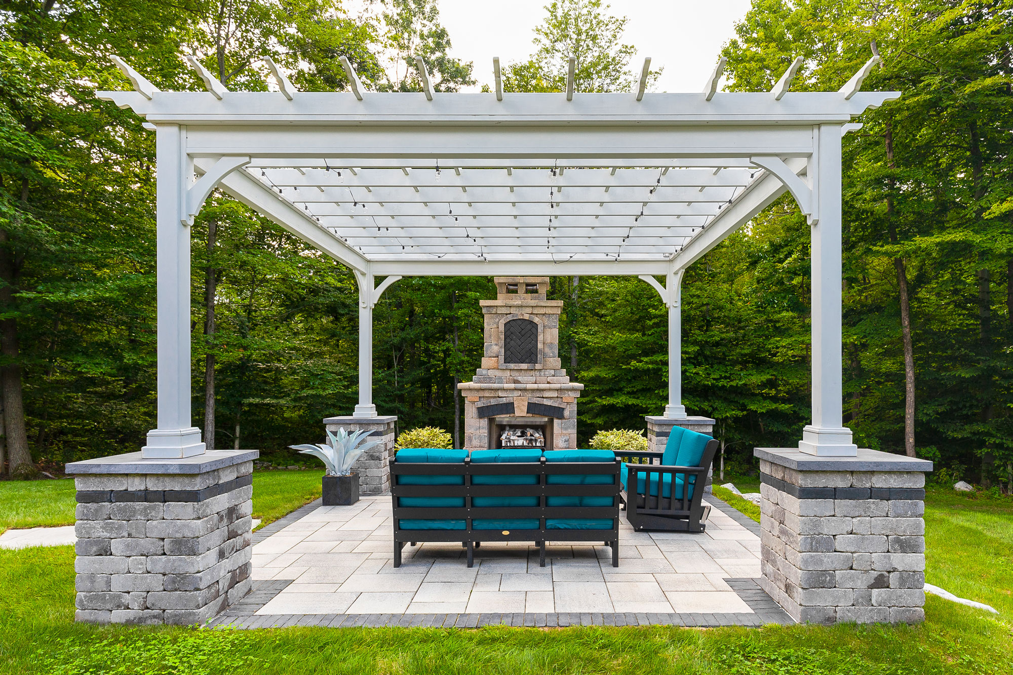 Custom pergola with fireplace and outdoor kitchen near Westchester New York by Neave Outdoor