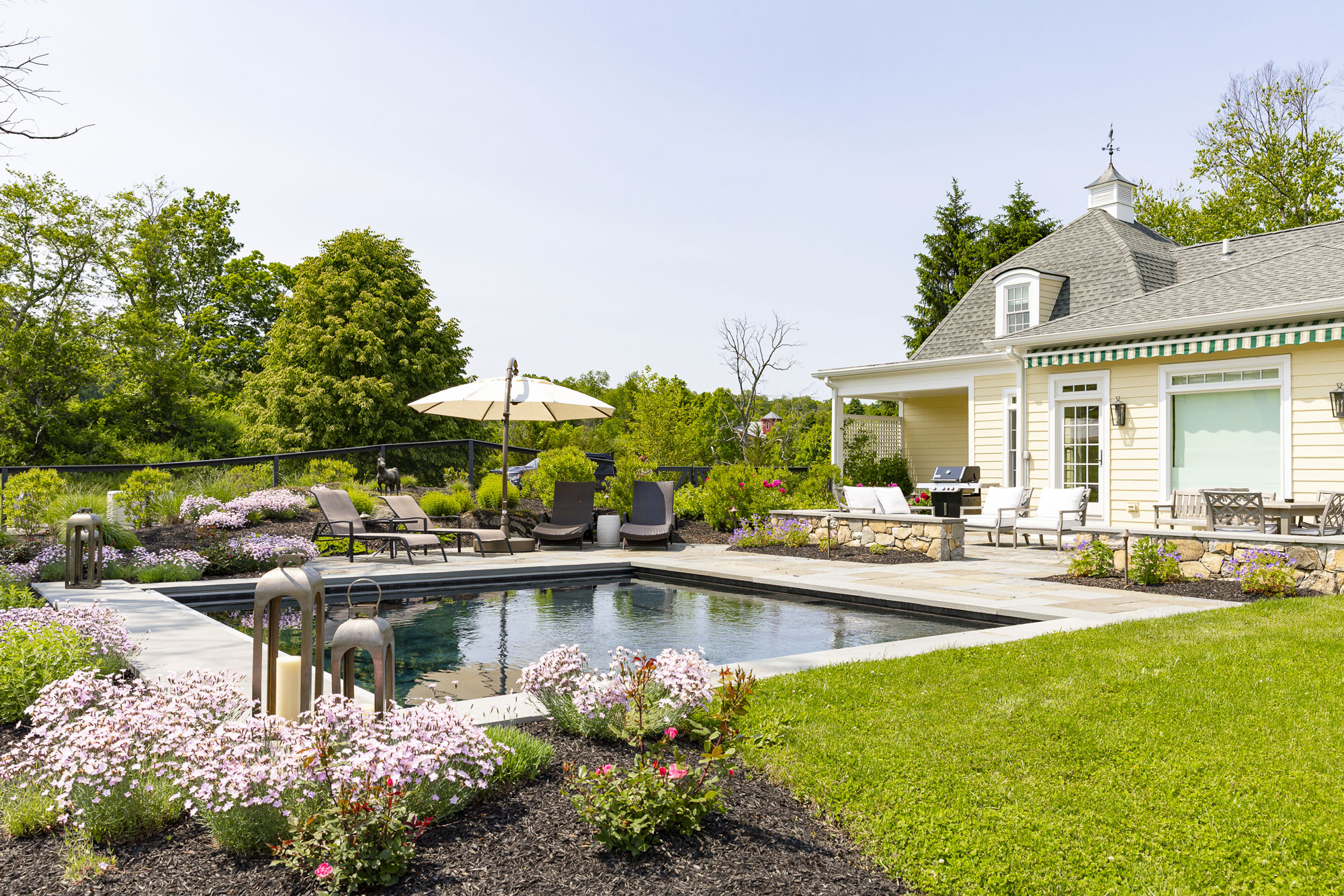 Small cocktail pool installation with hardscaping near Sullivan County New York by Neave Outdoor